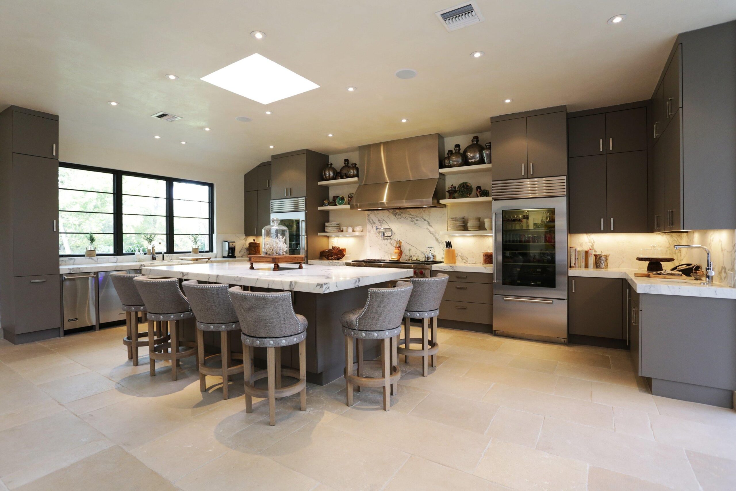 Furnished layout of grey colored kitchen.